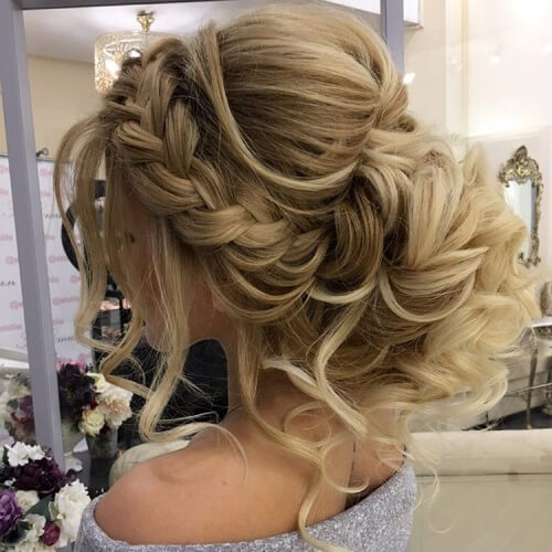 Voluminous Tied in a Braided Bun on One Side