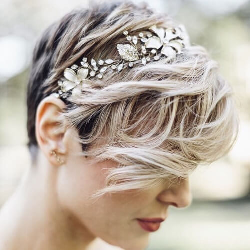 a woman with pixie cut and a tiara