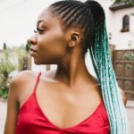 colored cornrows in ponytail and bun style