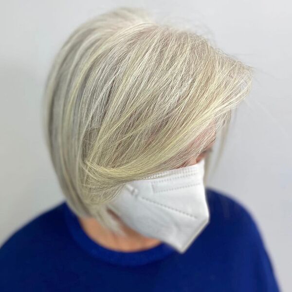Silver Bob Hairstyle - a woman wearing a dark blue and white facemask
