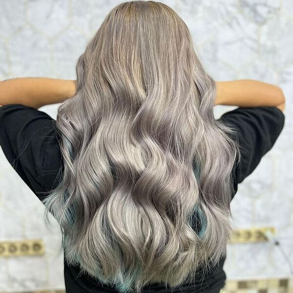 Aqua Green Tinted Ash Gray - a woman holding her hair and is wearing a black shirt