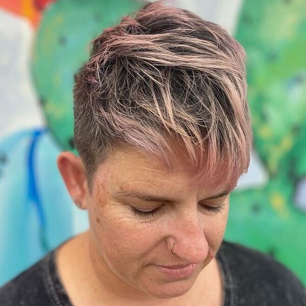Clipper Cut with Pink ends - a woman wearing a black plain shirt.