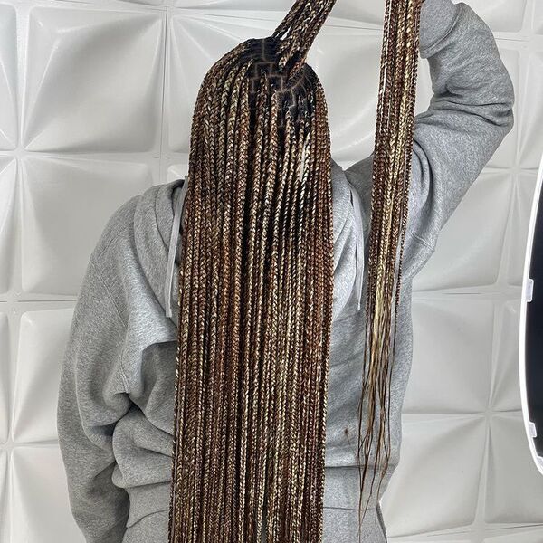 Corn Rows Stitch Braids - A woman wearing gray hoodie jacket and track pants.