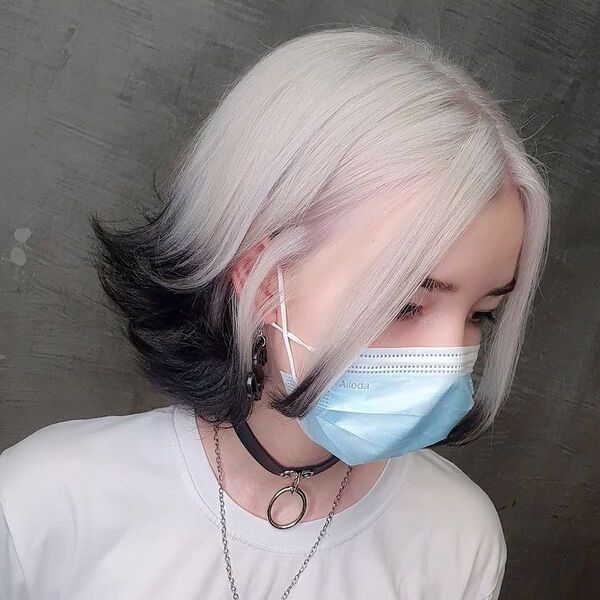 Retro Black and White Platinum Hair - a woman wearing a choker, white shirt and a facemask