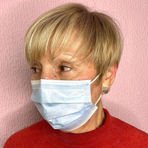Stunning Pixie on Women beyond 60 - a woman wearing mask in red turtle neck top.