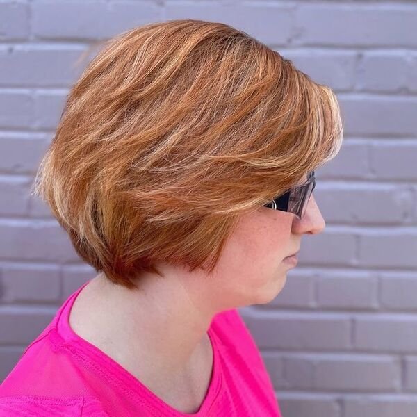 Blonde Balayage Short Bob - a woman wearing neon pink shirt.