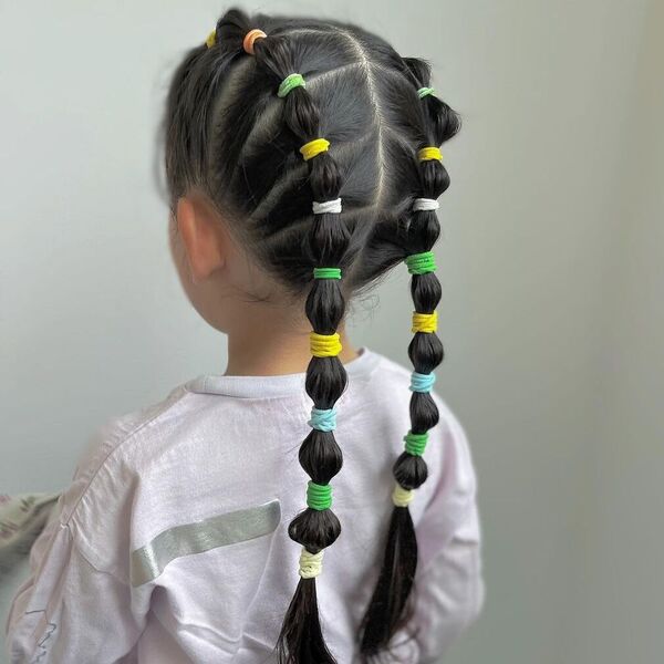Bubble Rubber Band Hairstyles for Girls - a girl wearing white long sleeves.