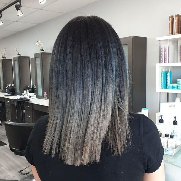 Charcoal Grey Ombre - a woman in a salon wearing a black shirt
