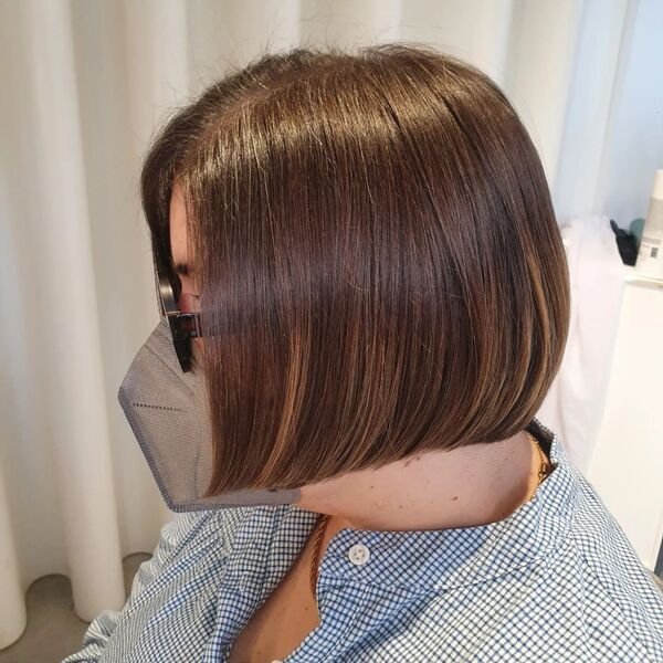 Chin Length Straight Bob - a woman wearing plaid blouse with mask and glasses.
