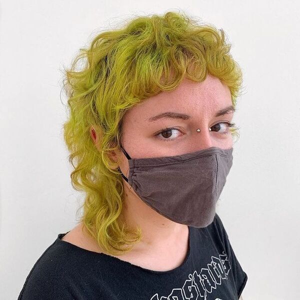 Clean Shag Mullet - A woman wearing a mask