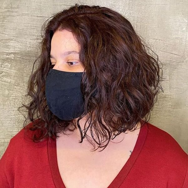 Curly Short Bob - a woman wearing mask and red shirt.