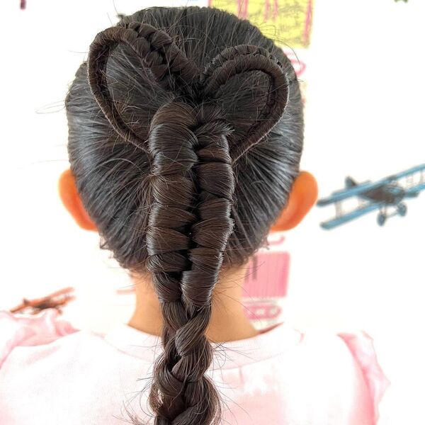 Heart Pull-through Braids Hairstyles for Girls- a girl wearing pink ruffles top.