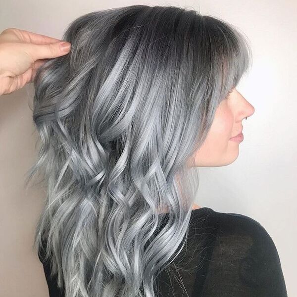 Light Grey Sky Ombre Hair with Bangs - a woman wearing a black see through blouse