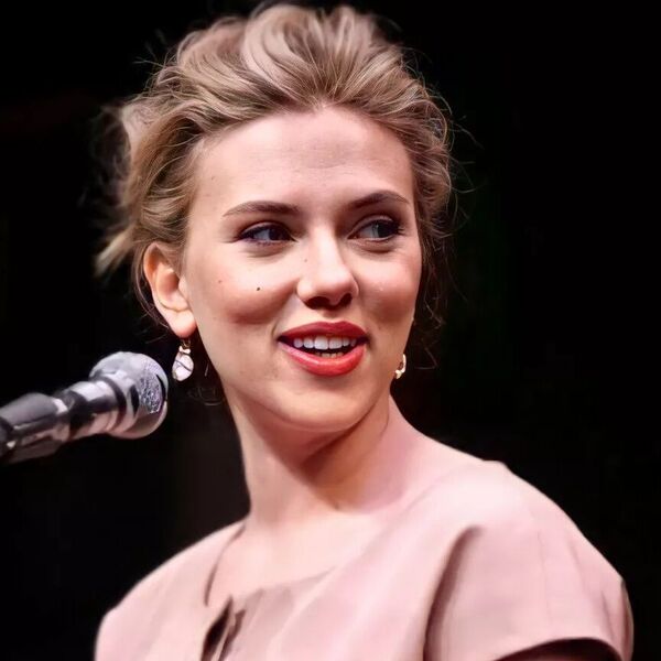 Loose Pompadour Bun - Scarlett Johansson is wearing nude dress.