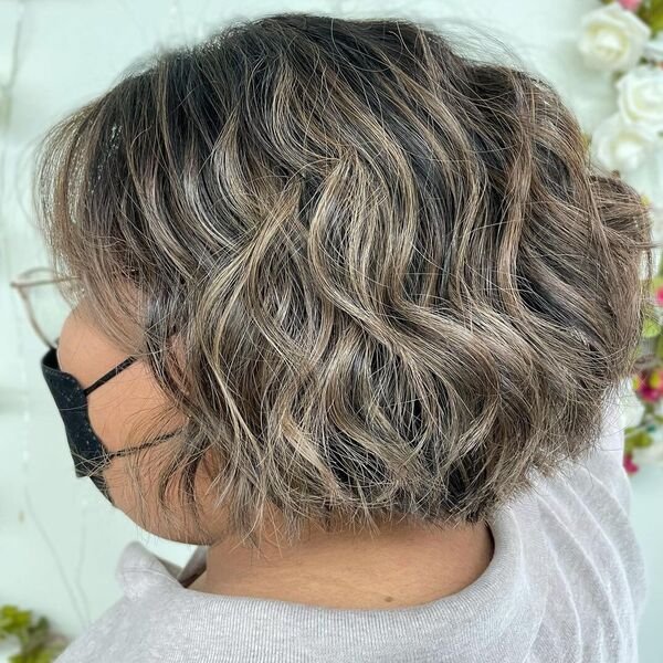 Short Bob Balayage Brunette - a woman wearing gray polo shirt.