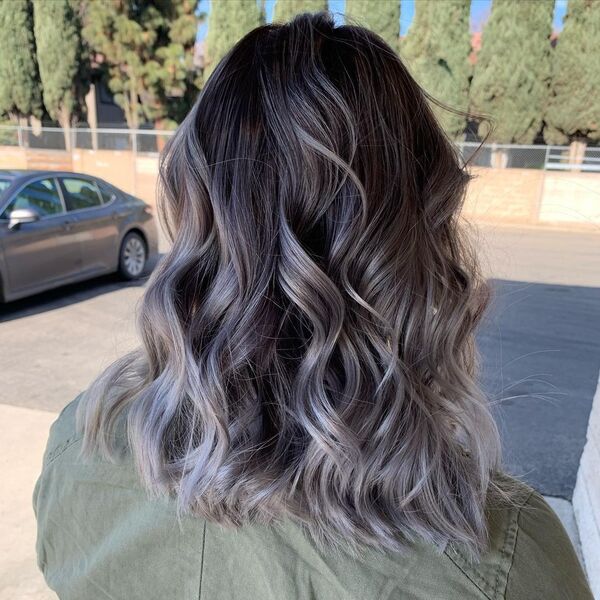 Slate Grey Ombre Hair - a woman wearing an olive green jacket