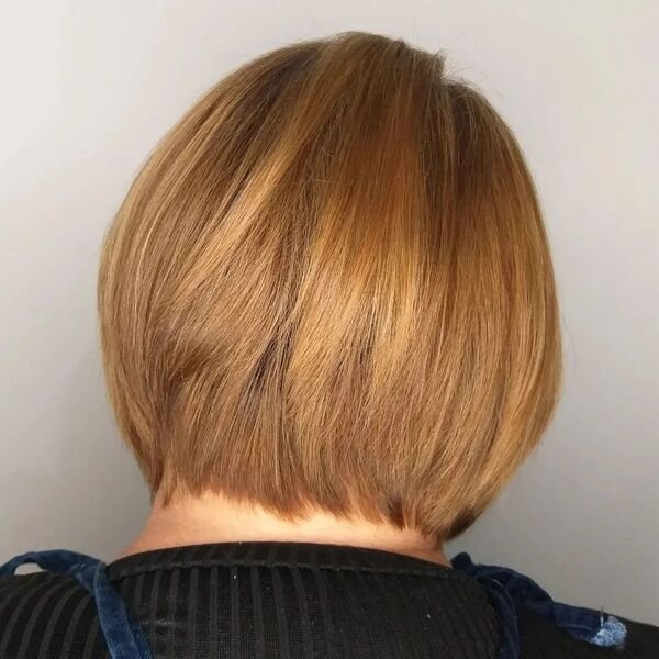 Soft Layered Short Bob - a woman wearing black shirt.