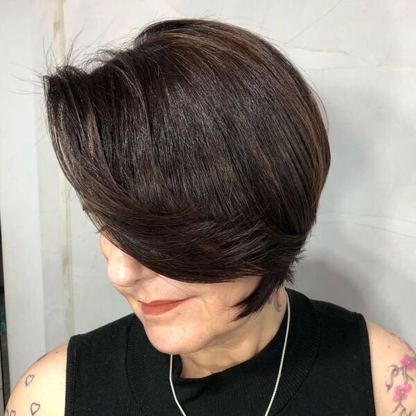 Stacked Bob with Feather Side Bangs - a woman is wearing black sleeveless top with silver necklace.