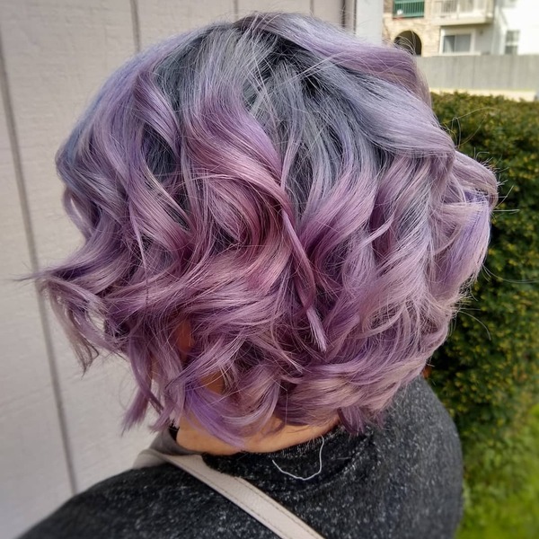 Stormy Lilac Stacked Bob - a woman wearing black dotted sweater.