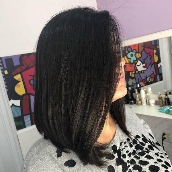 Well Define Straight Bob - a woman wearing gray shirt.