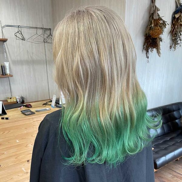 Blonde and Mint Green Ombre - a woman wearing a black cape