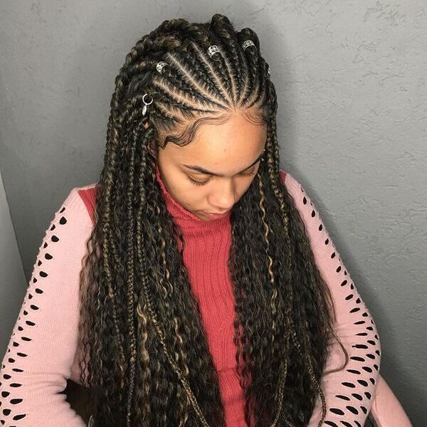 Curly Fulani Braids with Highlights - a woman wearing red pink sweater