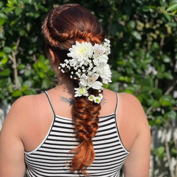 Fishtail Braids with White Flower - a woman wearing a stripe sleveless top