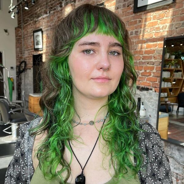 Green Shag Cut with Bangs - a woman inside a salon