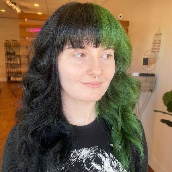 Green and Black Split Dye Hair - a woman wearing a black printed shirt