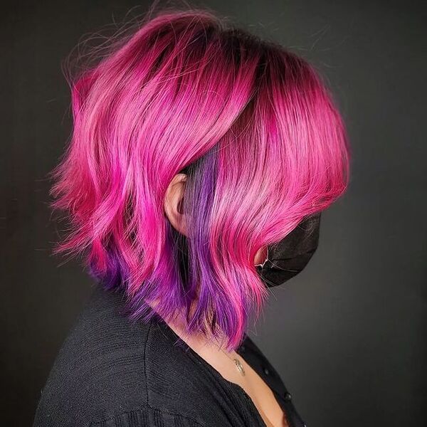 Hot Pink and Purple Peekaboo Hair - a woman wearing a black facemask