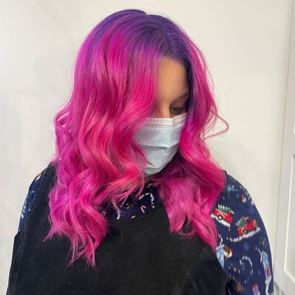 Mid-Length Pink and Purple Hair - a woman wearing a surgical facemask