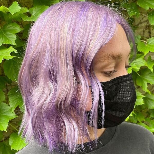 Pastel Purple Hair with Waves - a woman wearing a black facemask