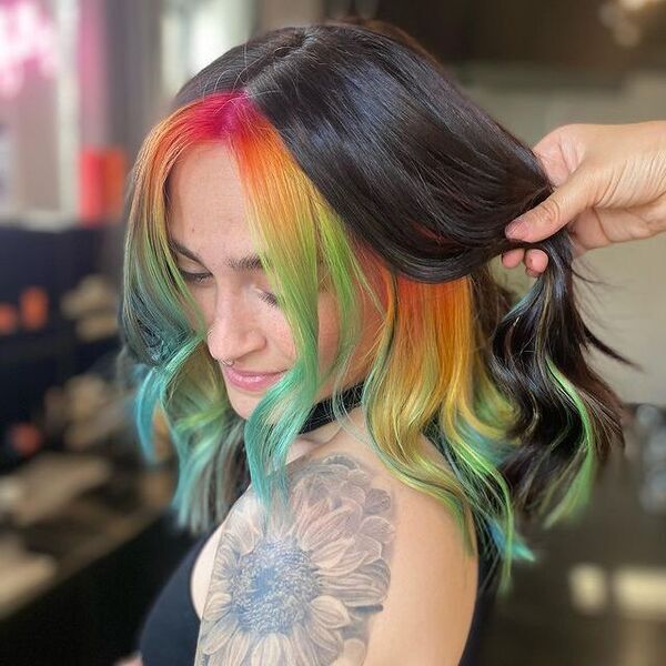 Peekaboo Rainbow Hair - a woman with tattoo wearing a black halter top