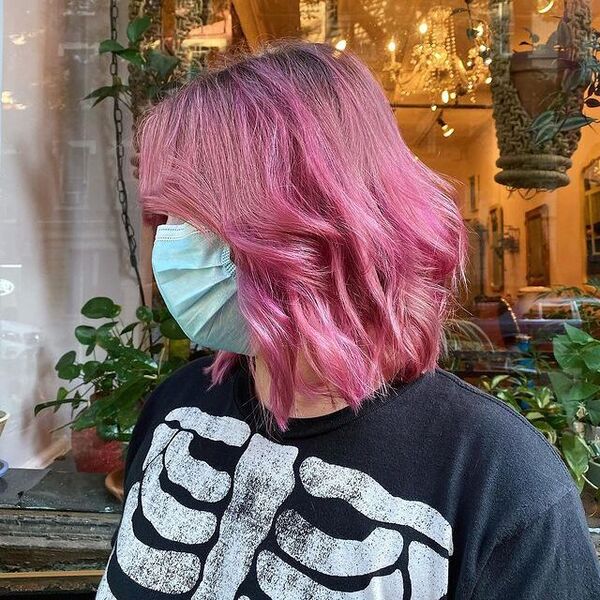 Pink Choppy Lob with Razored Cut - a woman with surgical facemask wearing a black printed shirt