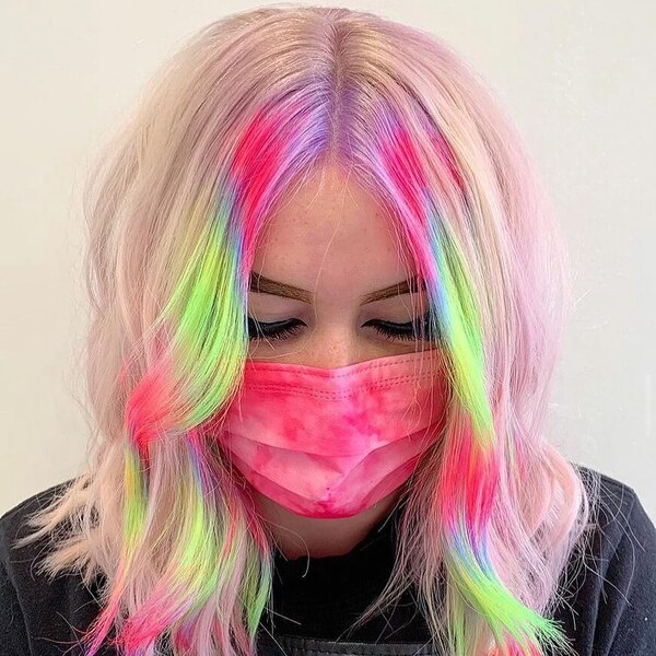 Rainbow Glow Hairstyles - a woman wearing a dye tie facemask