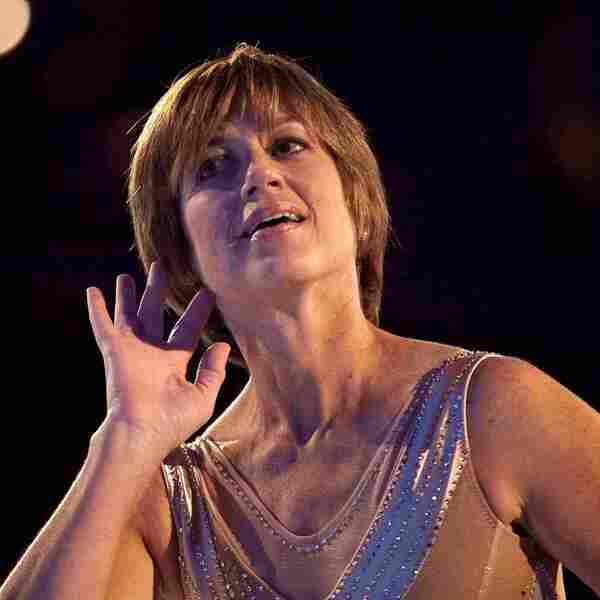 Volume Bowl Hairstyle - Dorothy Hamill is wearing nude skate suit