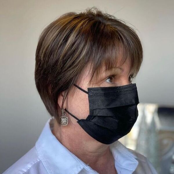 Pixie Cut - a woman wearing a black facemask