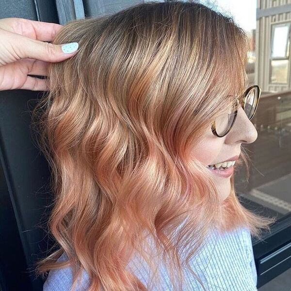 Blonde to Rose Gold Ombre Hair - a woman wearing a eyeglasses