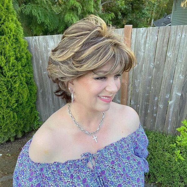 Short and Sassy Haircut - a woman wearing a floral off shoulder blouse