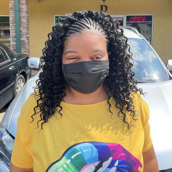 a woman with black facemask wearing a yellow blouse