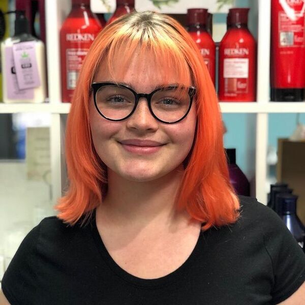 Light Orange on a Thin Hair - a woman wearing a eyeglasses