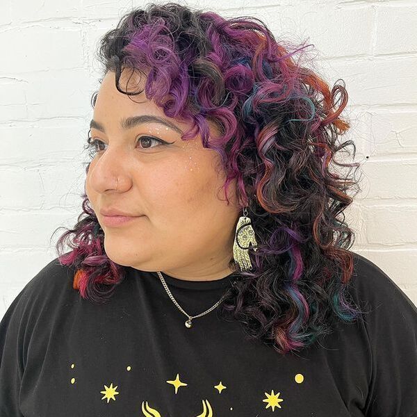 Oil Slick Hair - a woman with necklace wearing a black printed shirt