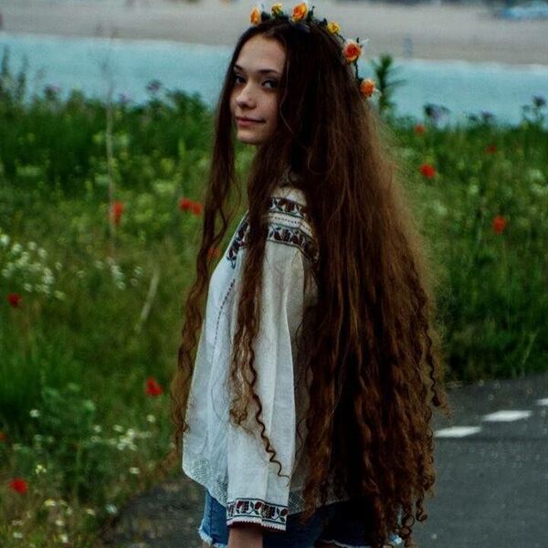 hippie hairstyle - a girl wearing a white bohemian dress