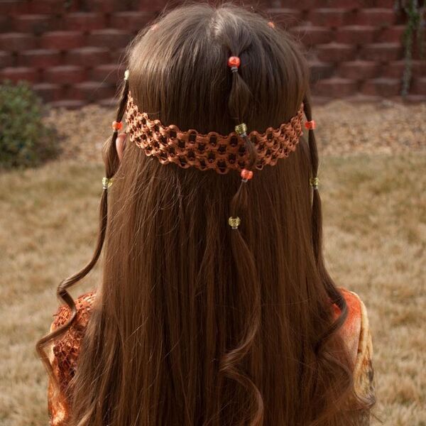 hippie hairstyle - a girl wearing brown printed blouse