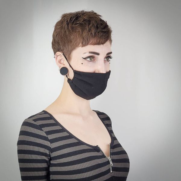 woman wearing a black face mask and stripes shirt