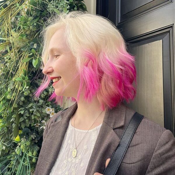 pink ombre hair - a woman wearing a suit and a necklace