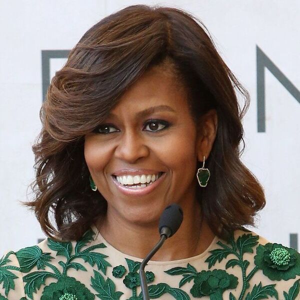 Michelle Obama - wearing a green dress