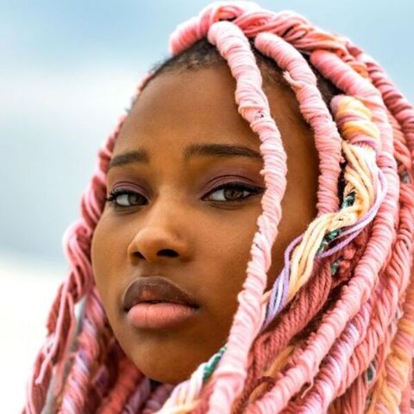 Pink Yarn Braids- a close up picture of a girl