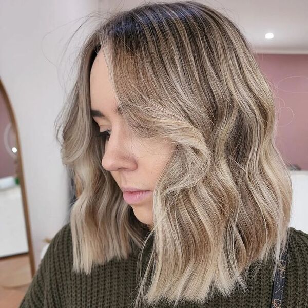 blonde highlights - a woman wearing a knitted longsleeve