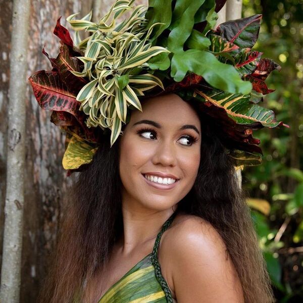 a woman wearing a hawaiian bra